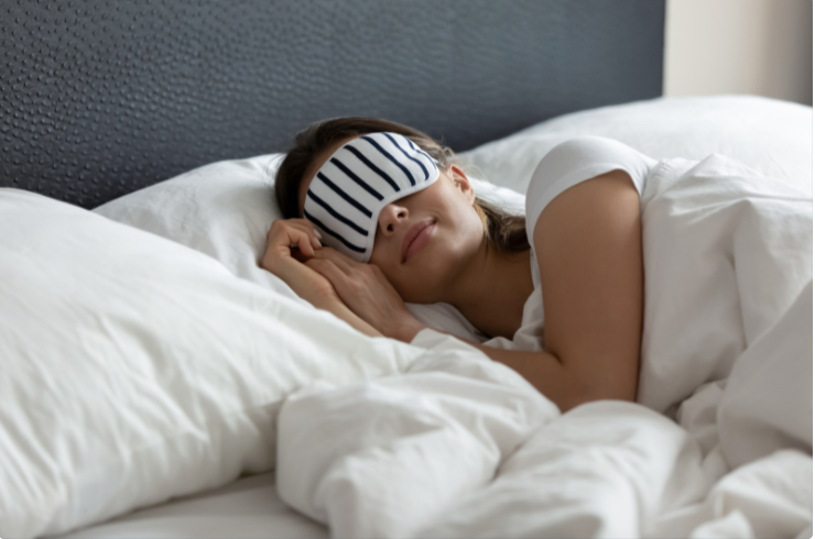 women in a deep sleep wearing a sleeping mask
