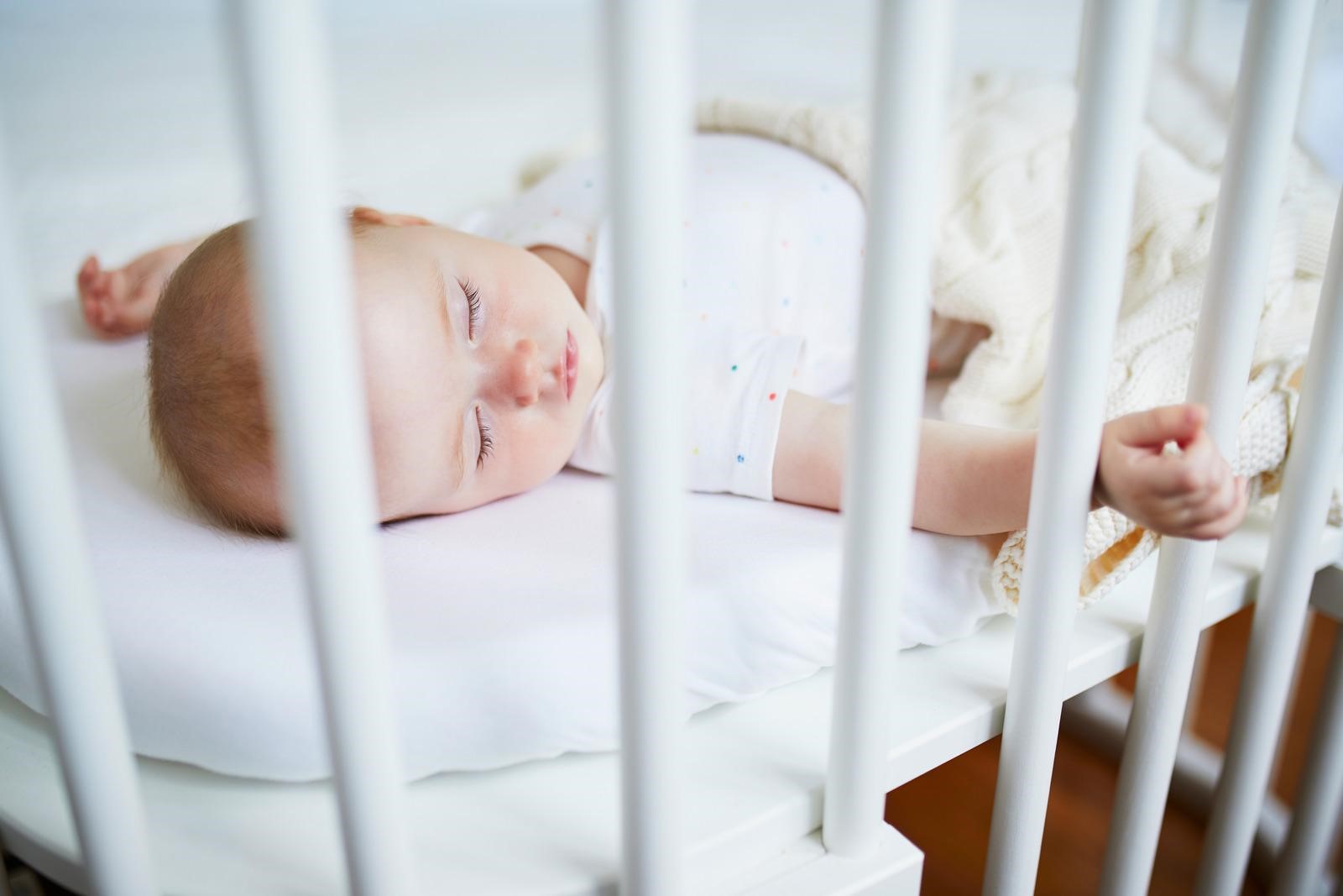 baby in crib mattress